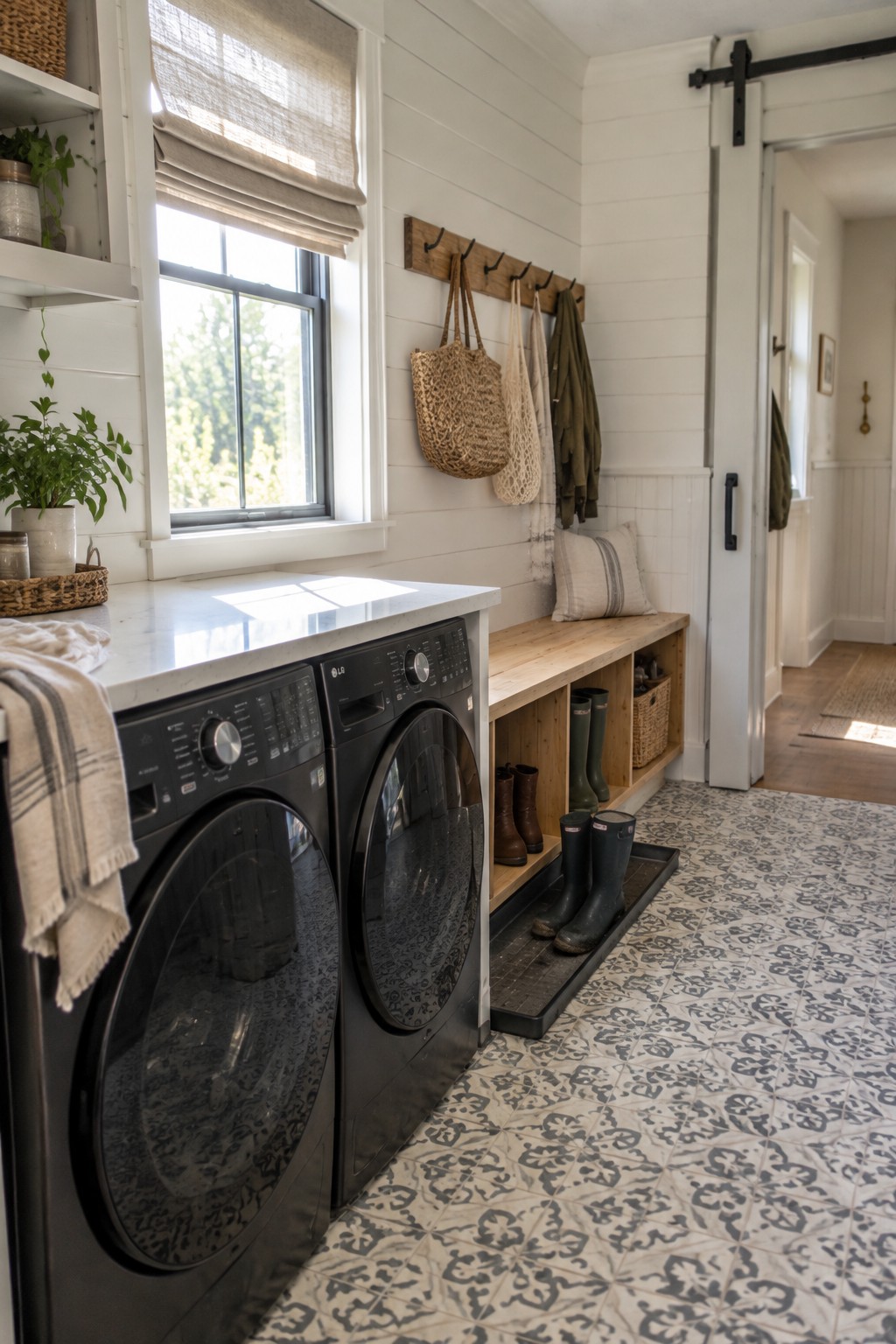 Black washer dryer set with wooden boot bench in bright white laundry room